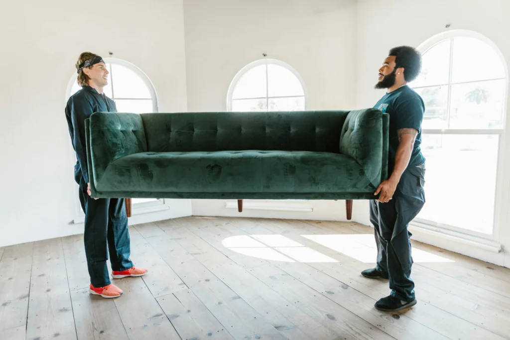 Movers lifting a sofa
