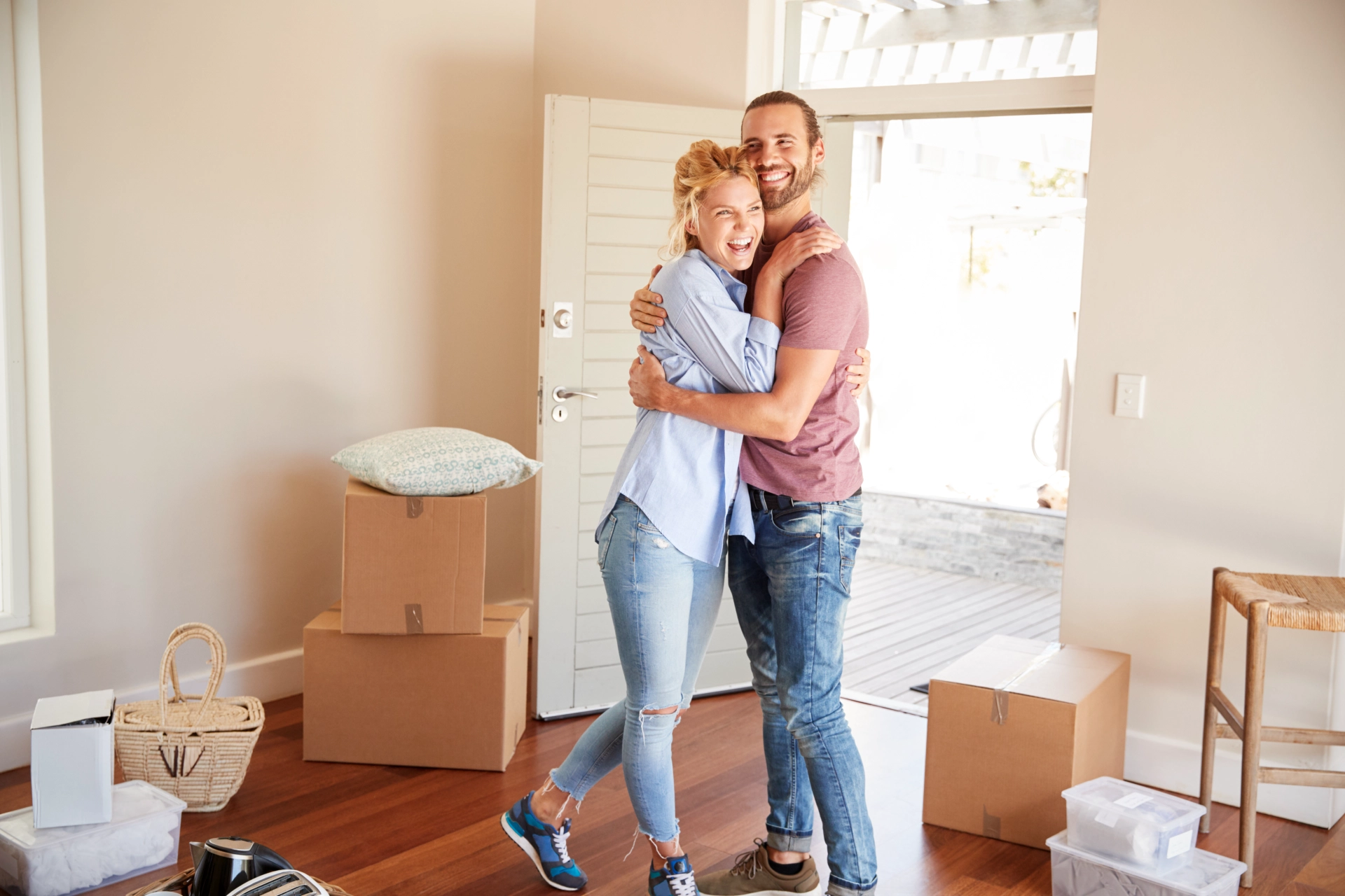 happy couple in their new home after moving to Worcester MA