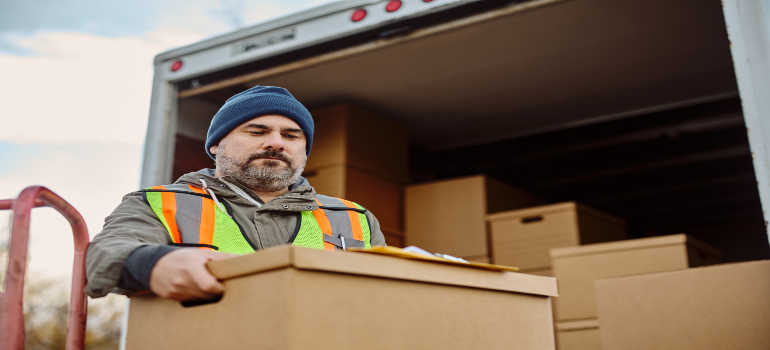 local movers in Worcester MA unloading boxes from a moving truck