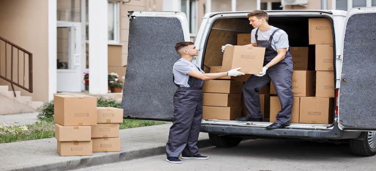local movers in Chelsea MA loading boxes into a moving truck