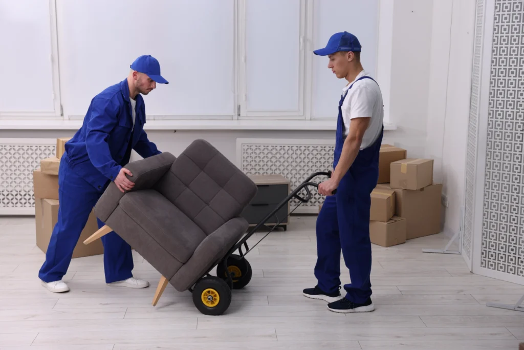 Professional movers carefully loading furniture for a local move in Chelsea MA