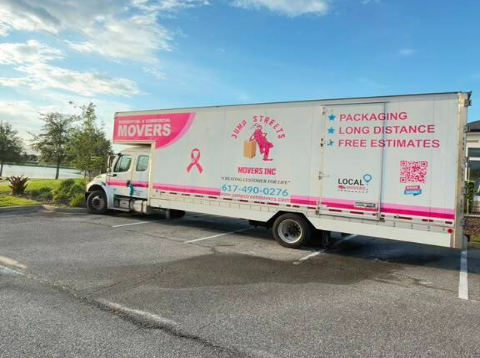 Jump Streets Movers pink ribbon truck serving Greater Boston, MA